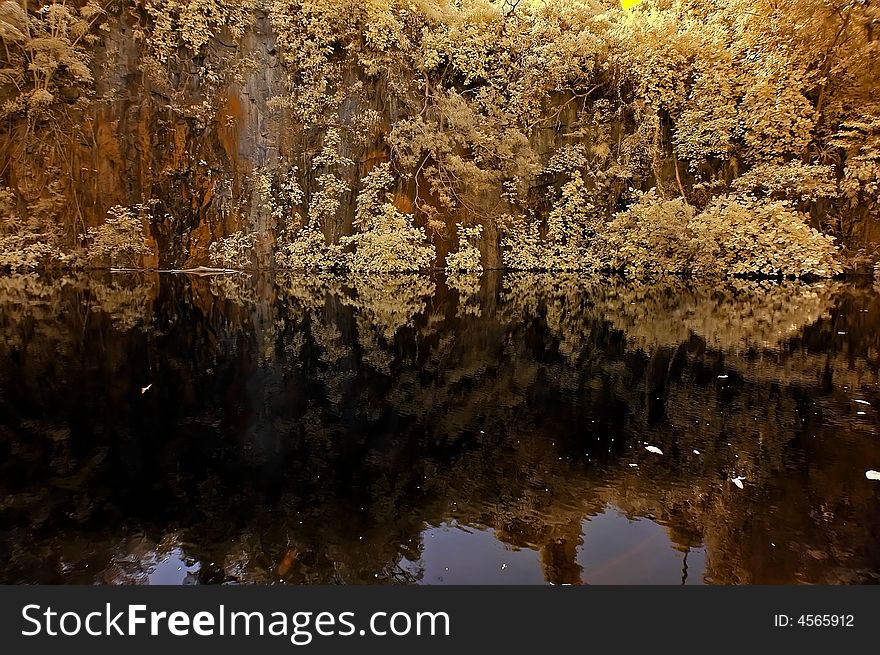 Infrared photo – lake, rock, reflection and tree