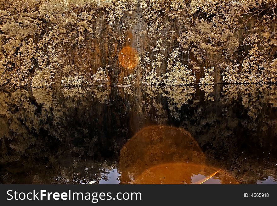 Infrared photo – lake, rock, reflection and tree in the parks