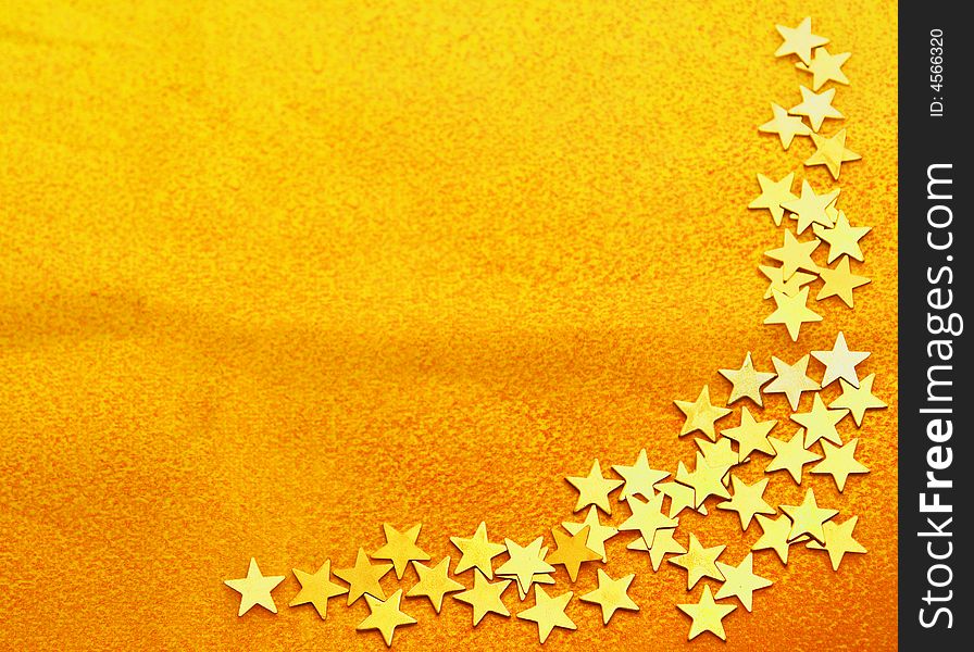 Orange texure background with decorative corner of small golden stars. Orange texure background with decorative corner of small golden stars