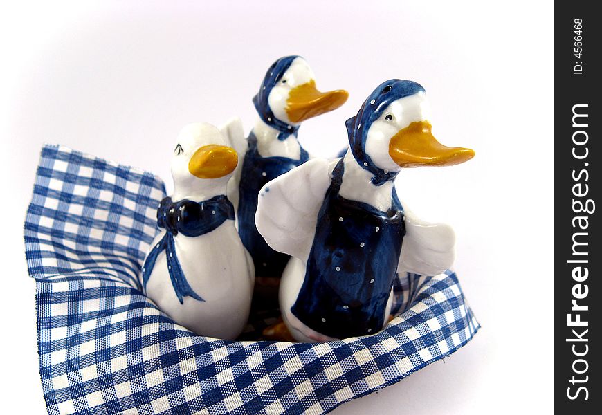 Three porcelain ducks for kitchen decoration isolated on white background