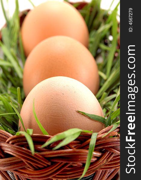 Three Easter Eggs In Basket With Grass