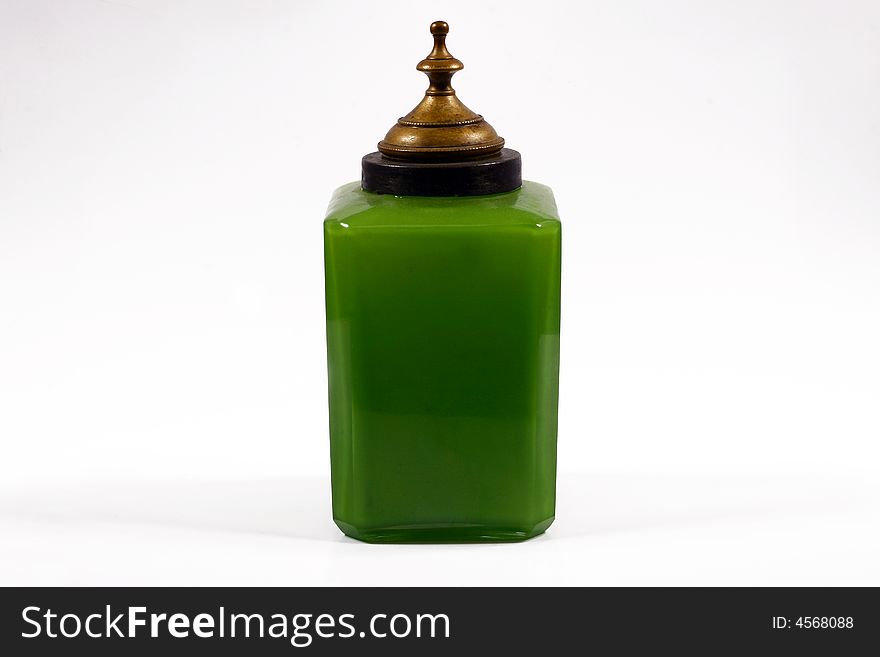 Jar from glass of green color, for storage of spices, with a metallic lid, can be utillized designers for creation and processing of different images. Jar from glass of green color, for storage of spices, with a metallic lid, can be utillized designers for creation and processing of different images