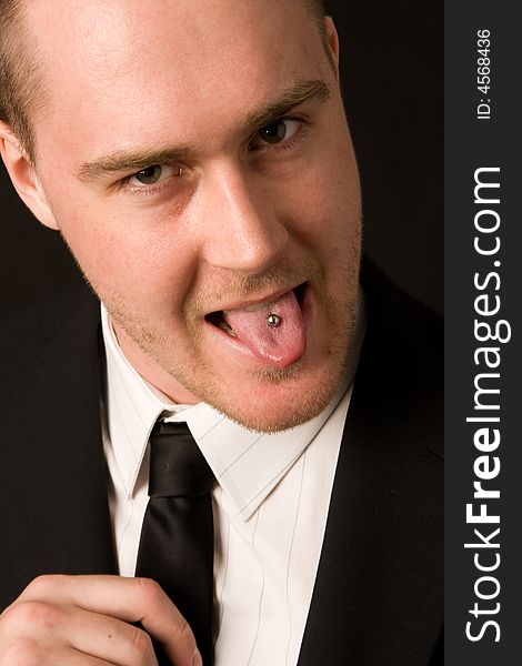 Portrait of a young businessman with tungpiercing. Portrait of a young businessman with tungpiercing