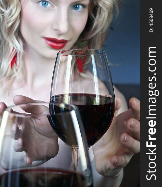 Red wine with a beautiful young blonde women
Focus on the wine. Red wine with a beautiful young blonde women
Focus on the wine