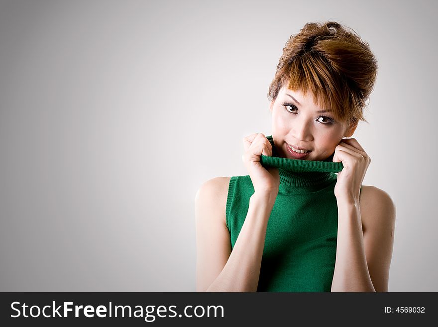 Woman smiling while flipping collar. Woman smiling while flipping collar