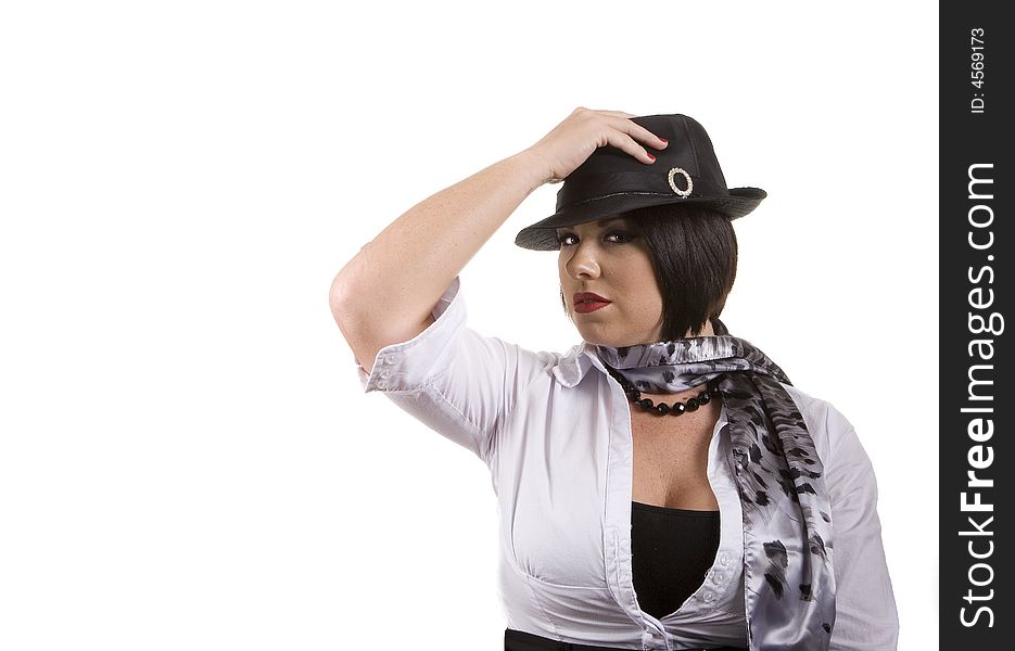 A woman with black hair a white blouse and scarf holding a black hat against a white background. A woman with black hair a white blouse and scarf holding a black hat against a white background