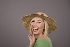 Blonde In Straw Hat Laughng Stock Image