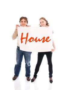 The Happy Couple With A Poster Isolated On A White Stock Image The Happy Couple With A Poster Isolated On A White Stock Image