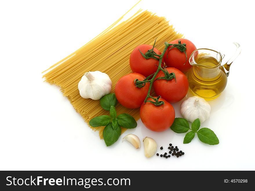 Spaghetti preparation: tomatoes, olive oil, garlic and basil