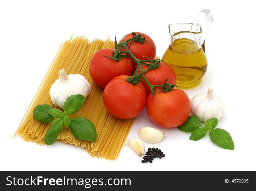 Spaghetti preparation: tomatoes, olive oil, garlic and basil