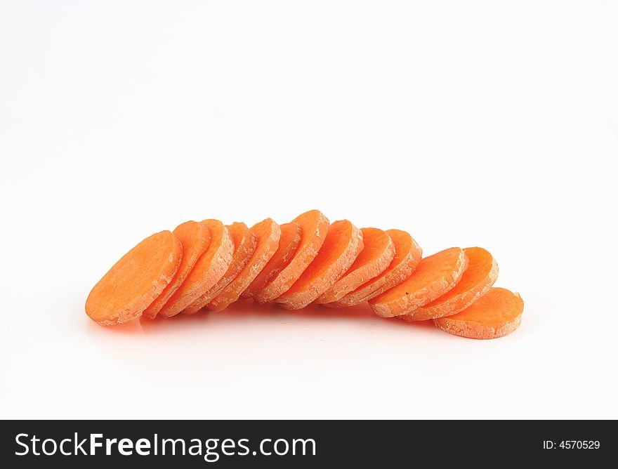 Slices of carrot isolated against a white background. Slices of carrot isolated against a white background