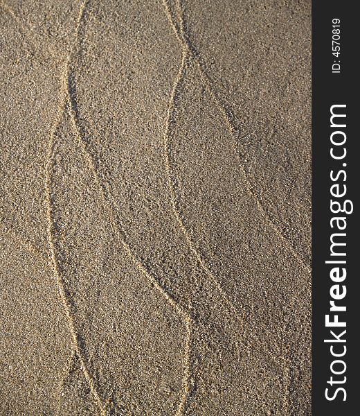 Patterns in sand left by tidal waves on the New Jersey beach of Ocean Grove--  vertical version of a series of two. Patterns in sand left by tidal waves on the New Jersey beach of Ocean Grove--  vertical version of a series of two