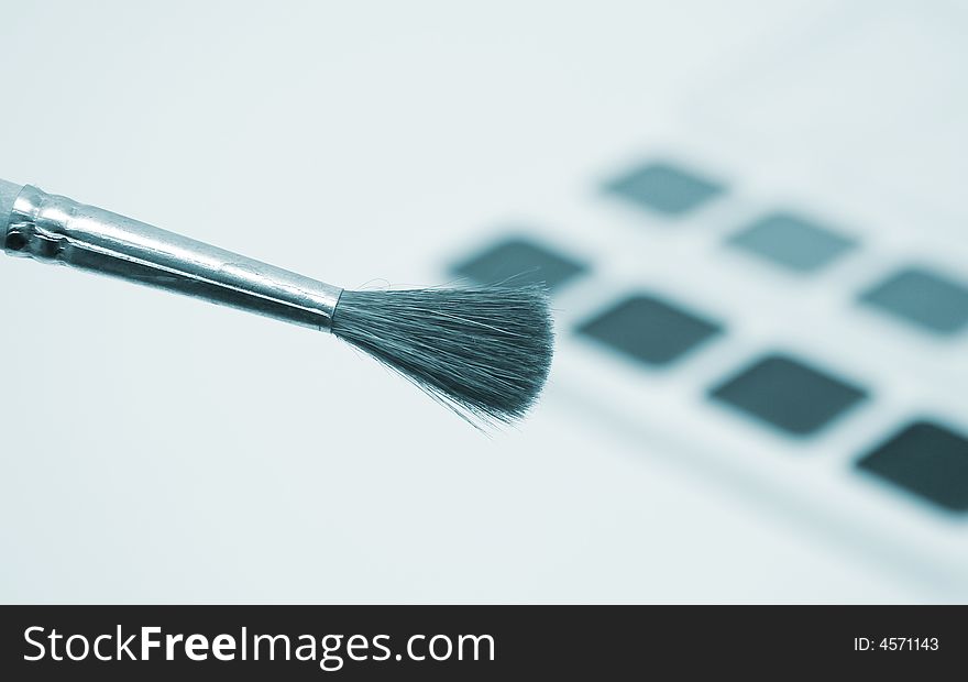 Brushes and paint isolated on white. Brushes and paint isolated on white