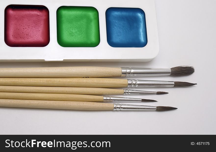 Brushes and paint isolated on white. Brushes and paint isolated on white