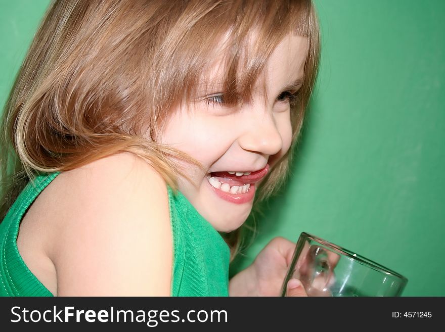 Laughing girl with a cup