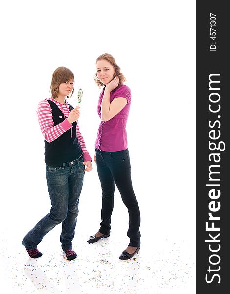 The two girls with a sugar candy isolated on a white background