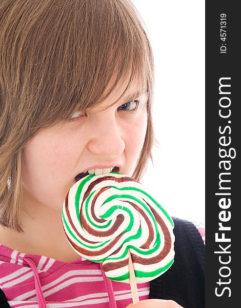 The girl with a sugar candy isolated on a white background