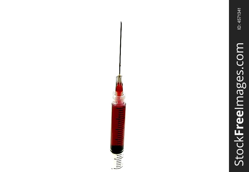 An injection isolated on a white background. The blood used in it is not real.