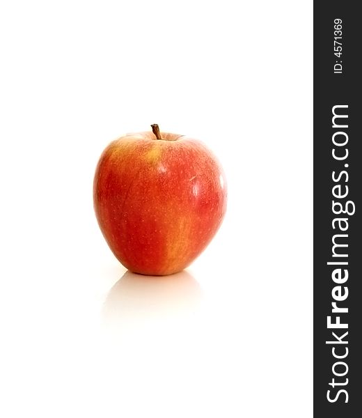 A shiny red apple isolated on a white background. A shiny red apple isolated on a white background.