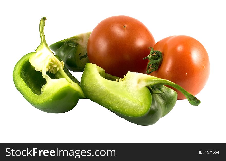 Red tomatoes and green pepper over white. Red tomatoes and green pepper over white