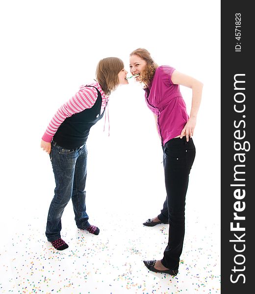 The two girls with a sugar candy isolated on a white background