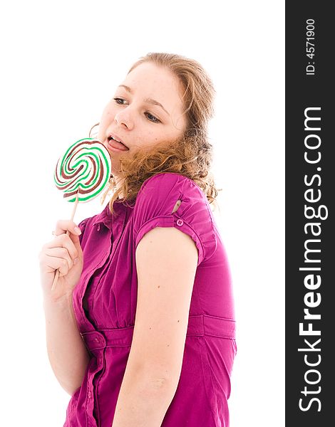 The girl with a sugar candy isolated on a white