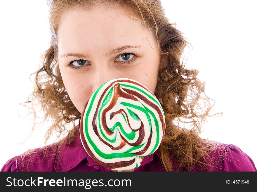 The girl with a sugar candy isolated on a white