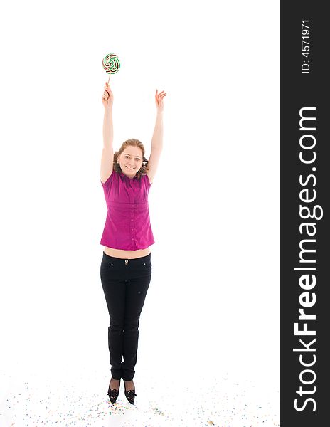 The young jumping girl with a sugar candy isolated on a white background