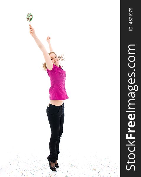 The young jumping girl with a sugar candy isolated on a white background