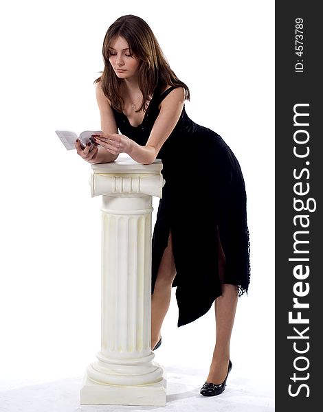 Standing lady in black reading manual. Standing lady in black reading manual