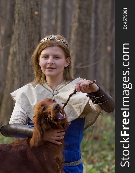 Portrait of the girl and irish setter in autumn forest. Portrait of the girl and irish setter in autumn forest.