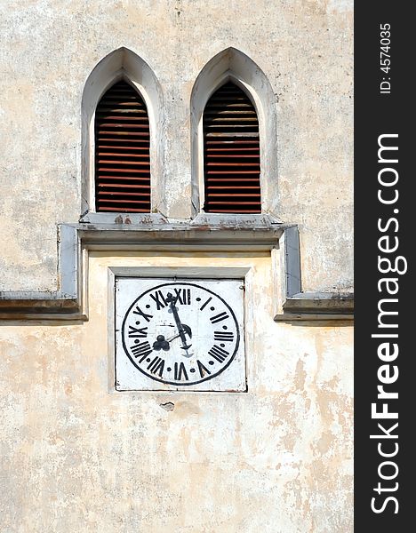 A view with a watch on church tower. A view with a watch on church tower