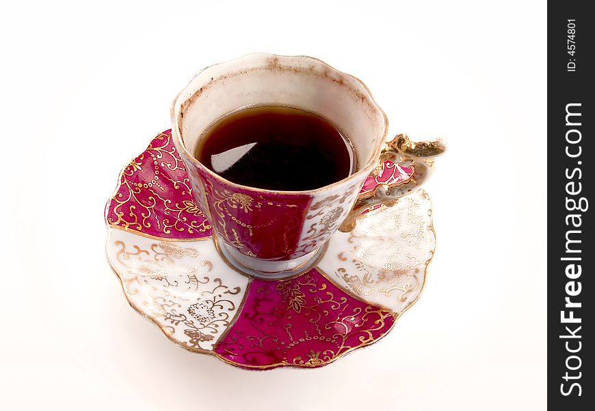 A cup of Turkish coffee, served with old porcelain cup. A cup of Turkish coffee, served with old porcelain cup.