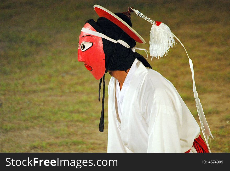 Side View Of Mask Dancer