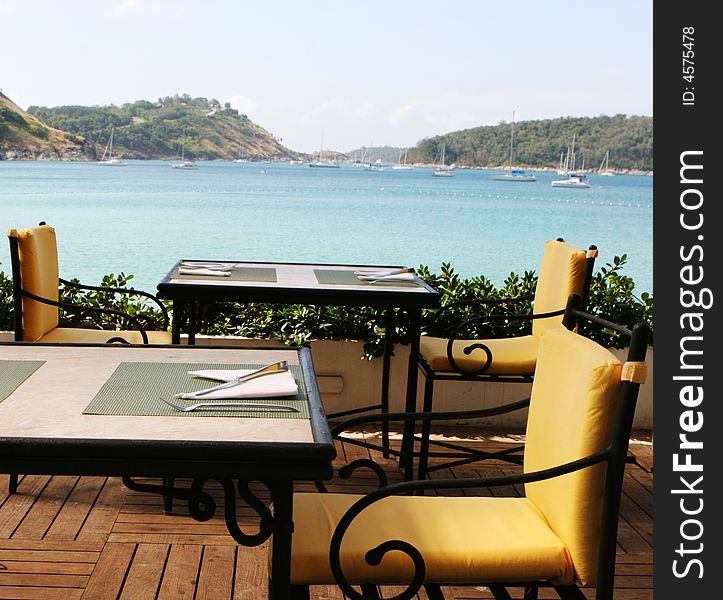 Table at a restaurant overlooking ocean views. Table at a restaurant overlooking ocean views.