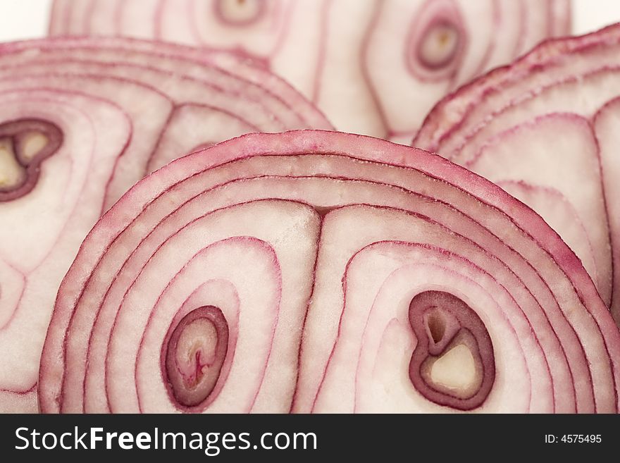 Sliced red onion, isolated on white, close-up