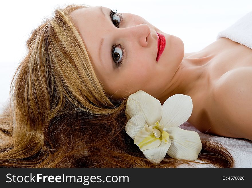 Attractive woman getting spa treatment on white