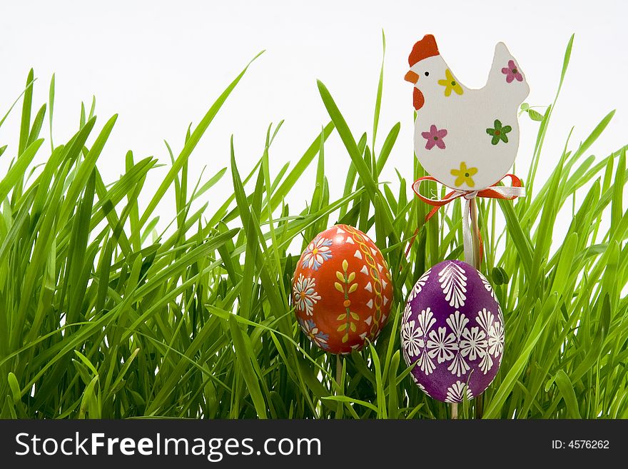 The easter eggs and hen in grass. The easter eggs and hen in grass
