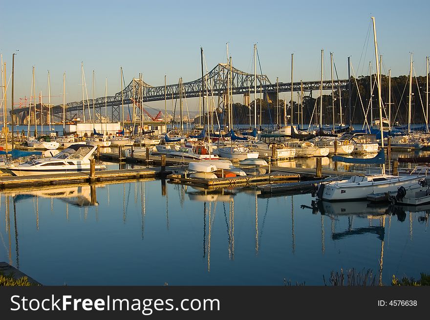 Marina next to Bay Bridge in San Francisco at sunset