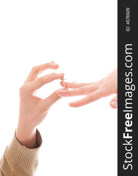 Two hands with a ring isolated on a white