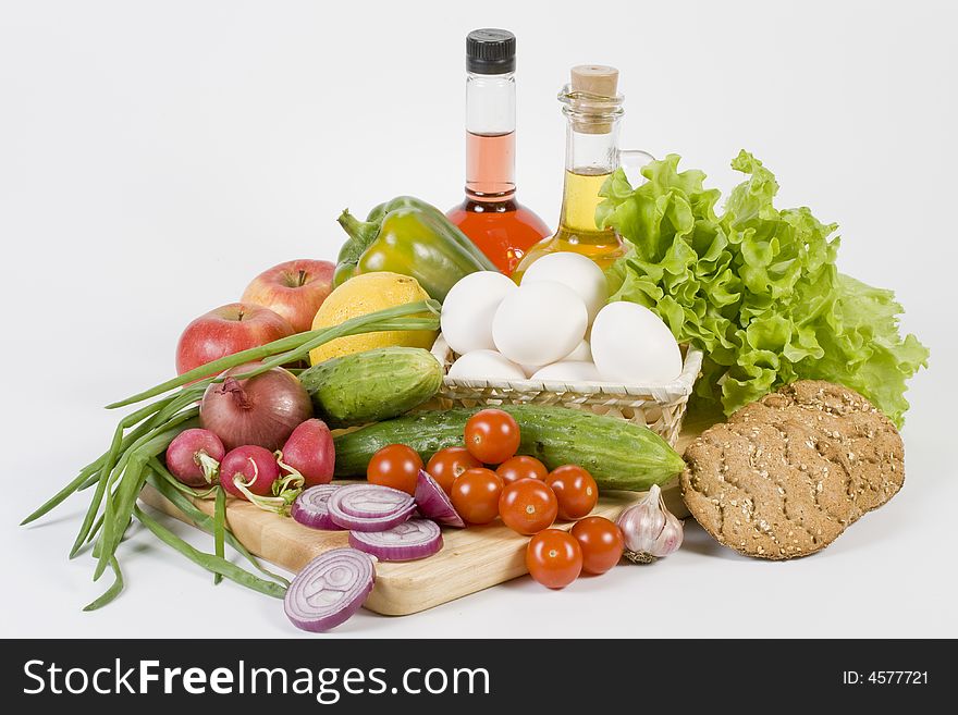 Still-life with vegetables isolated on a white background. Still-life with vegetables isolated on a white background.