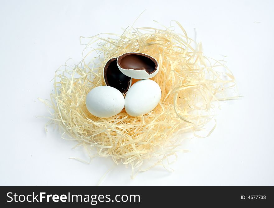 Realistic looking chocolate easter eggs in nest