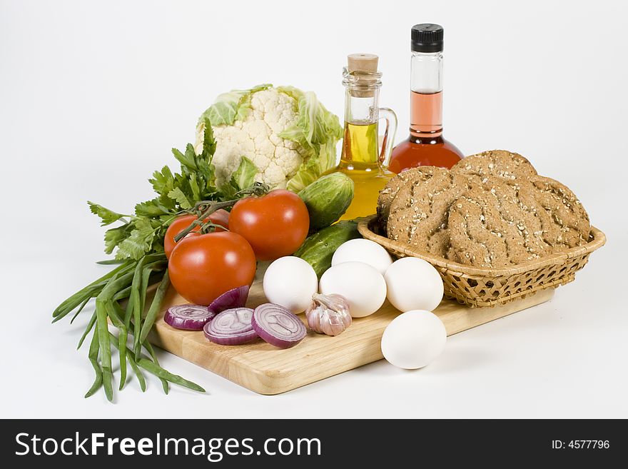 Still-life with vegetables isolated on a white background. Still-life with vegetables isolated on a white background.