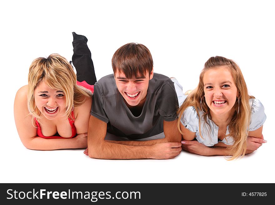 Boy and two girls lying on white