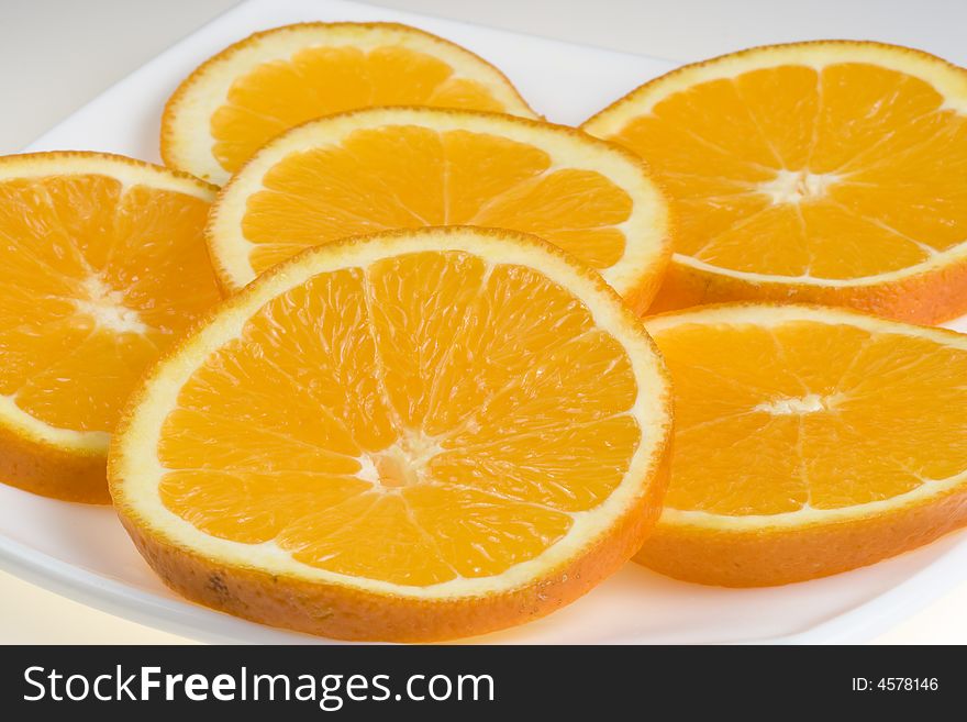 Background from the fresh, juicy, cut oranges. Background from the fresh, juicy, cut oranges