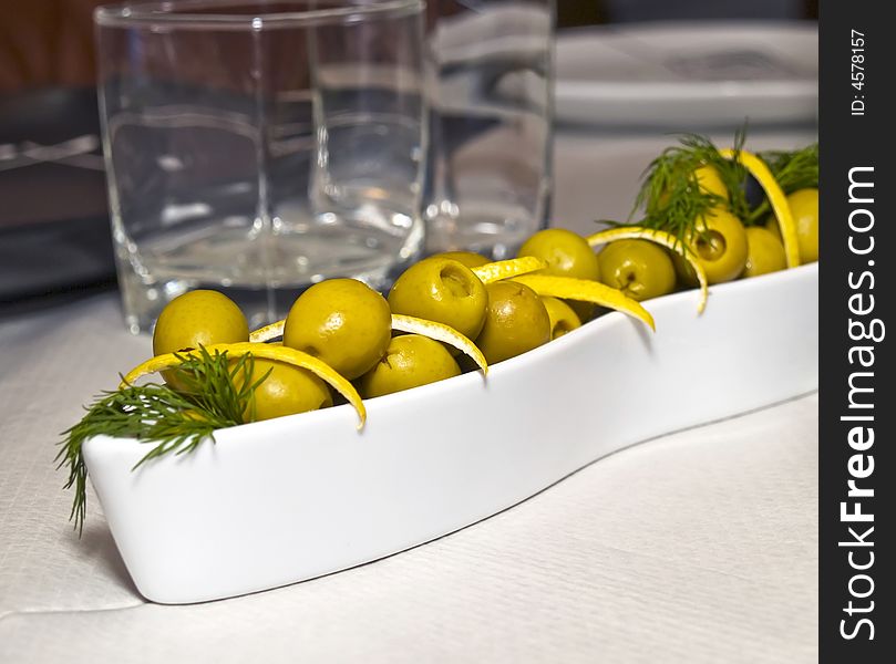 A collection of green olives like part of the mediterranea diet
