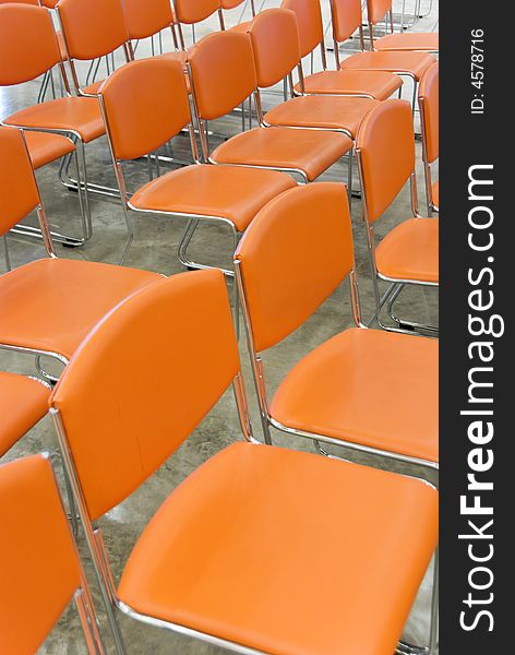 A long row of orange chairs