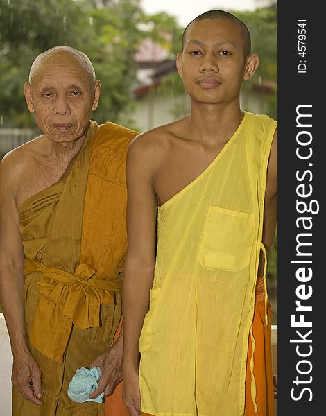 Buddhist monk with a novice follow. Buddhist monk with a novice follow