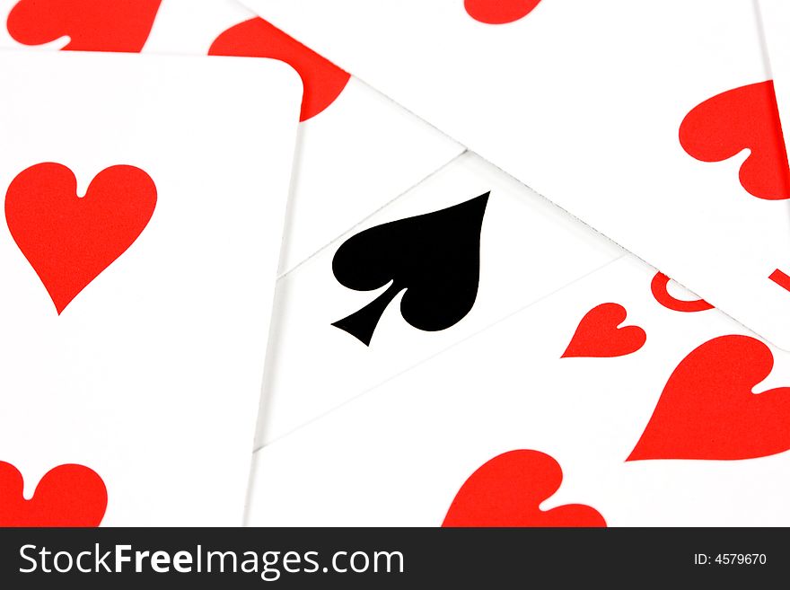 Playing cards with red hearts and one black heart