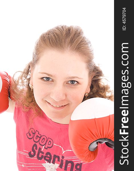 The young beautiful girl with boxing gloves isolated on a white background. The young beautiful girl with boxing gloves isolated on a white background